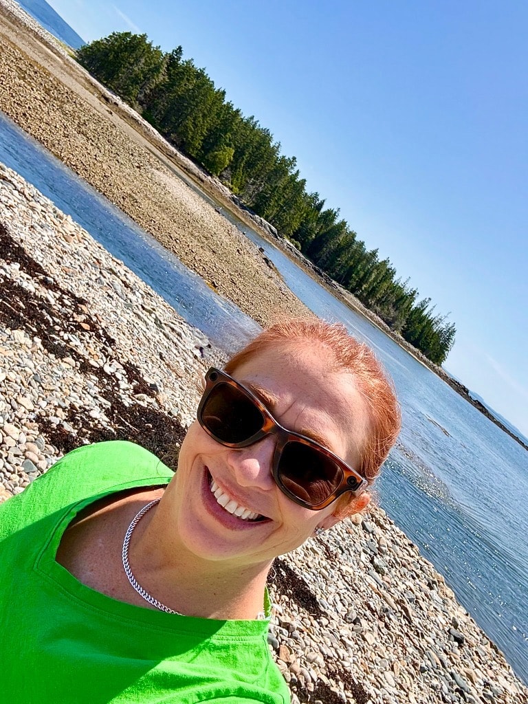 Liz smiling on a rocky Schoodic Peninsula shoreline